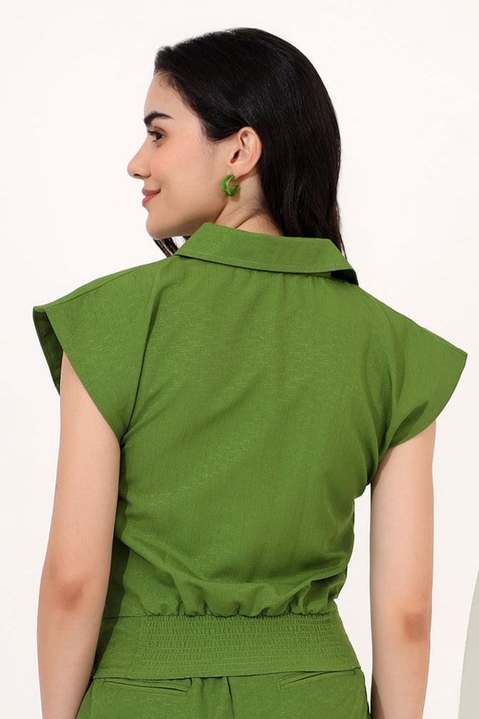 a green shirt with power shoulders
