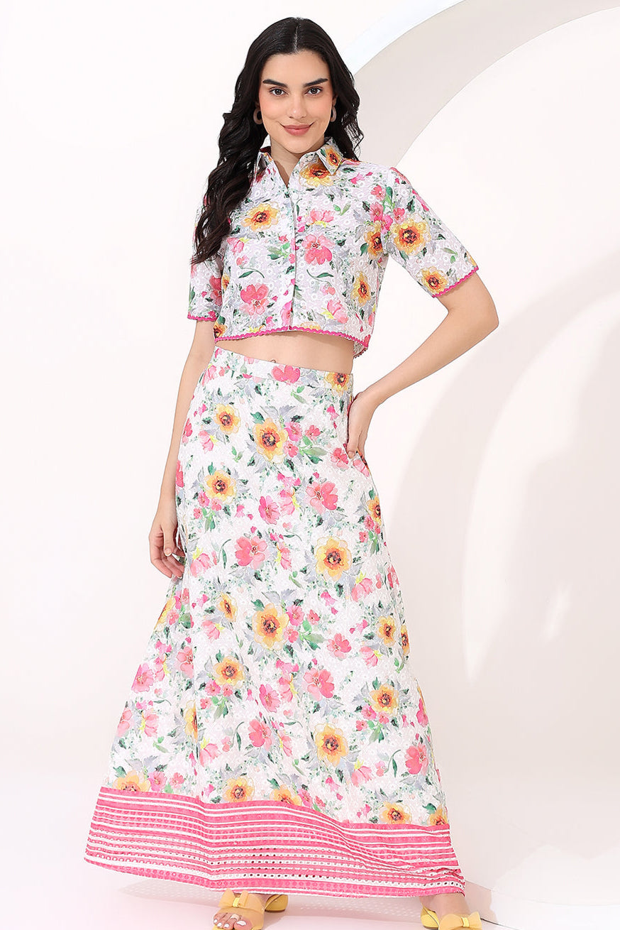 Woman wearing a floral outfit with a white background