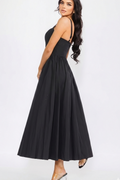 Woman wearing a black dress on a white background