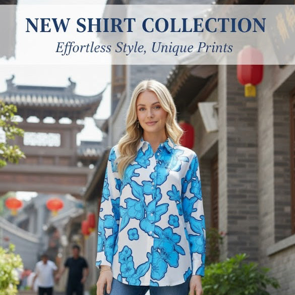 Woman wearing a blue floral shirt and jeans standing on steps with a building and people in the background.